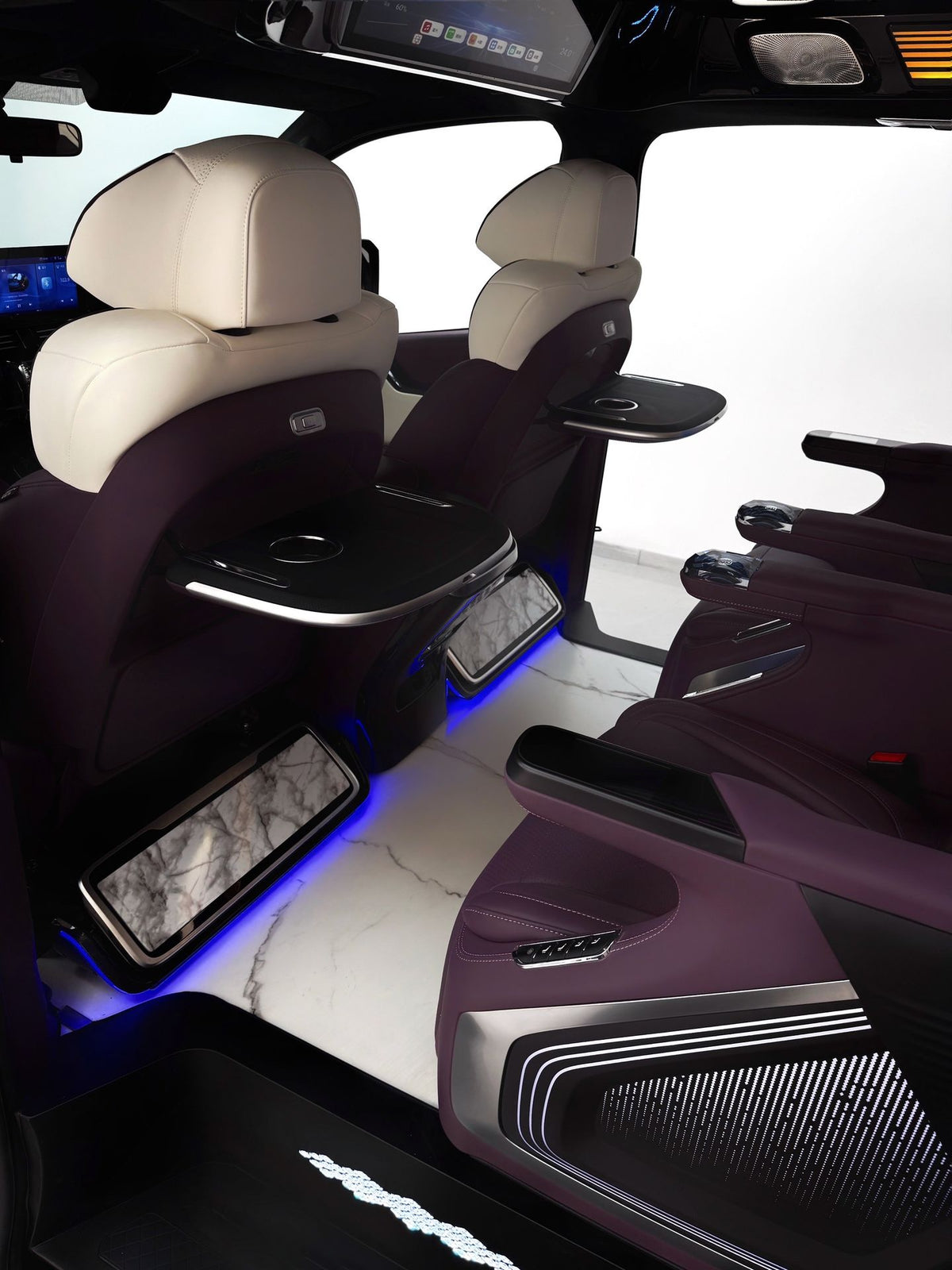 Toyota Sienna interior customization featuring luxury seats, overhead lighting, curtains, flooring, folding tables, and more.
