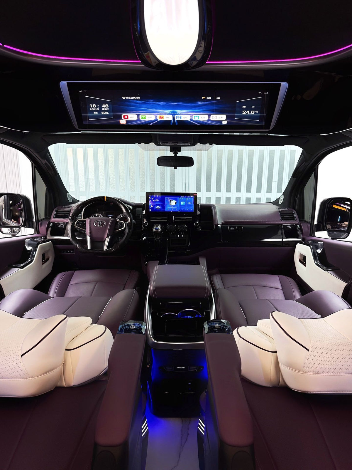 Toyota Sienna interior customization featuring luxury seats, overhead lighting, curtains, flooring, folding tables, and more.