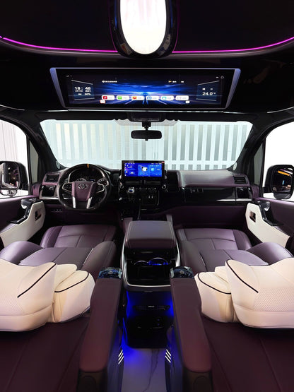 Toyota Sienna interior customization featuring luxury seats, overhead lighting, curtains, flooring, folding tables, and more.