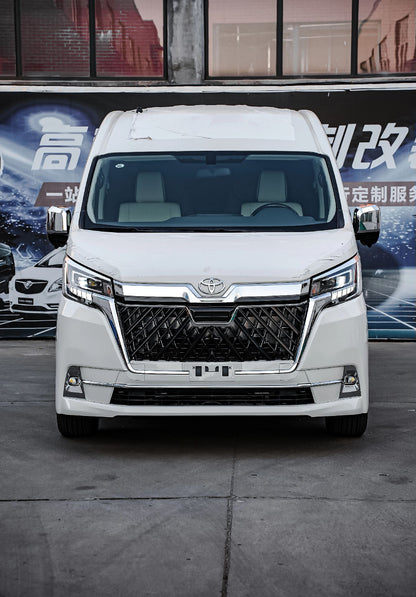 For Sale: Toyota Hiace Sienna with exterior kit and interior modifications including luxury seats/bed and clothes rack.