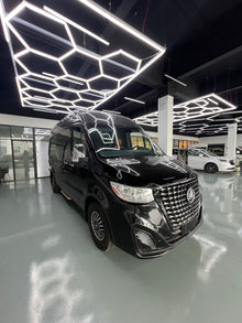 Toyota HiAce upgrade package: luxury seating, waterproof flooring, electric curtains, and a concealed bar/seating unit.