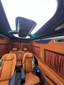 Toyota HiAce upgrade package: luxury seating, waterproof flooring, electric curtains, and a concealed bar/seating unit.