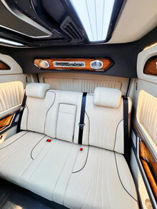 A luxury package for the 7-seater Toyota Hiace featuring a partition and hidden seats.