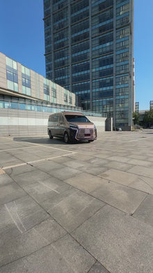 Toyota HiAce: Custom body kit, alloy wheels, aviation-style seats, and a convertible bed